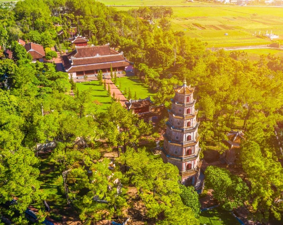 Aerial view of the iconic pagoda overlooking the Perfume River at sunrise