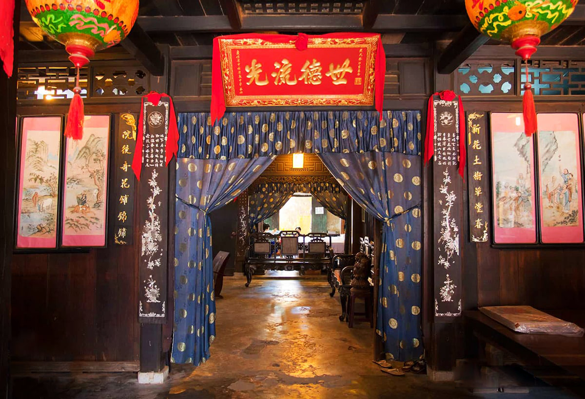 Ancestral altar and traditional interior inside a historic merchant residence in Hoi An