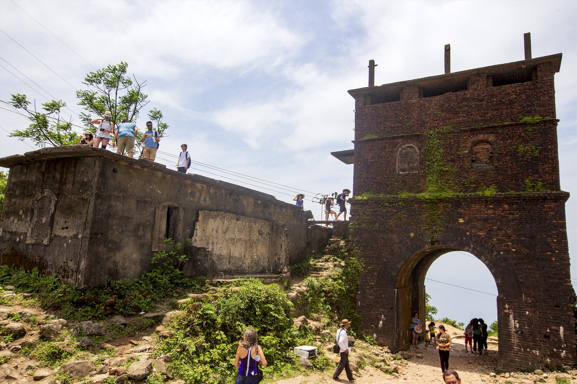 Ancient stone gate and historic remains at the summit of the coastal pass
