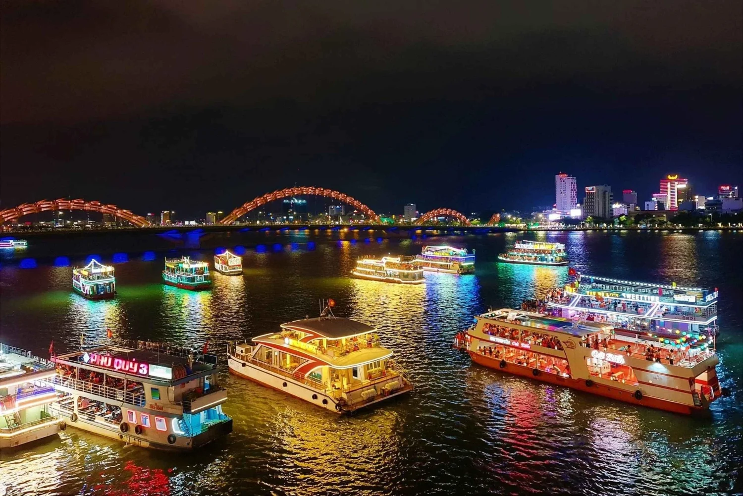 City skyline of Da Nang illuminated along the Han River at night
