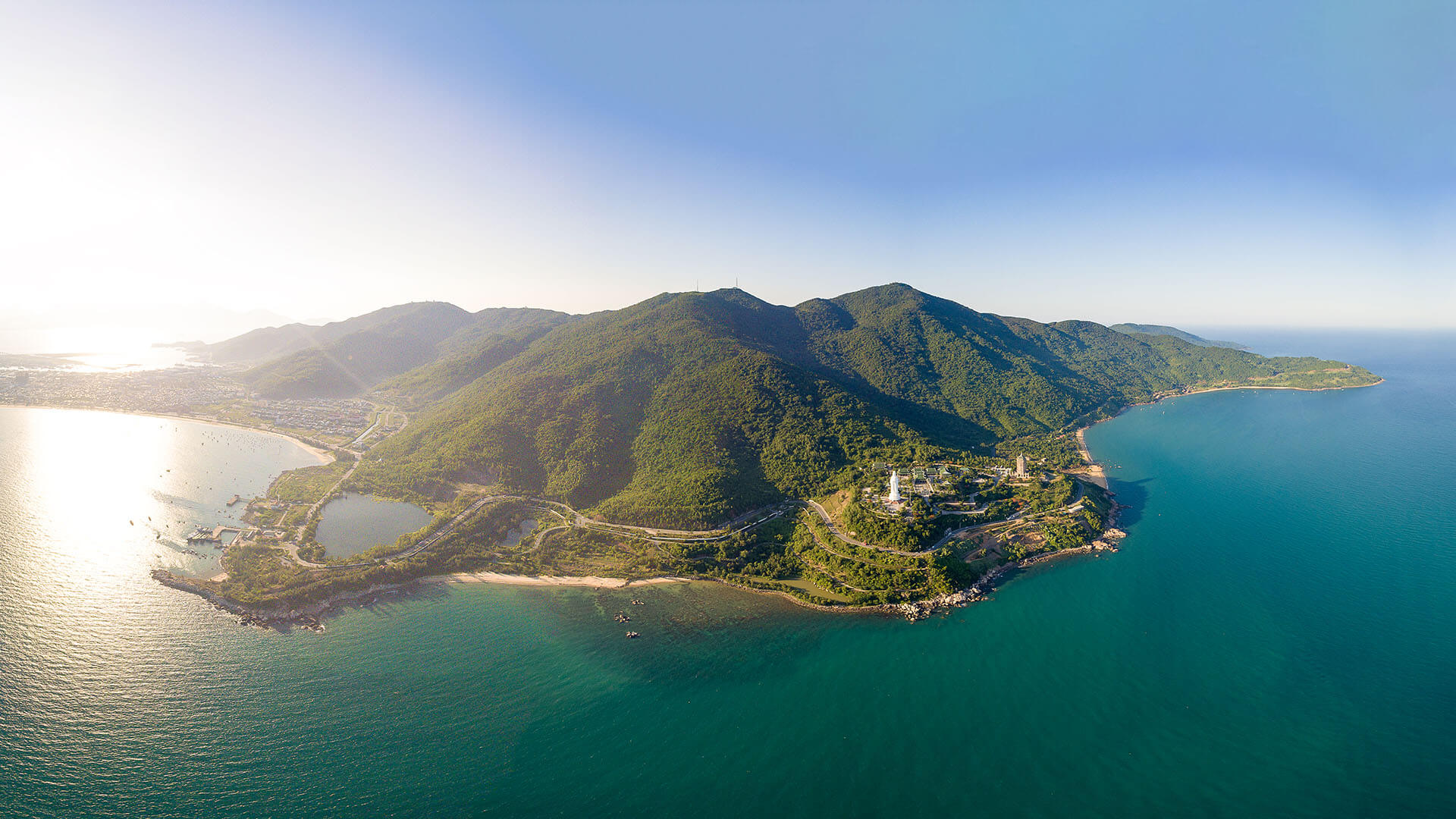 Clear blue skies during the dry season along a tropical coastline.
