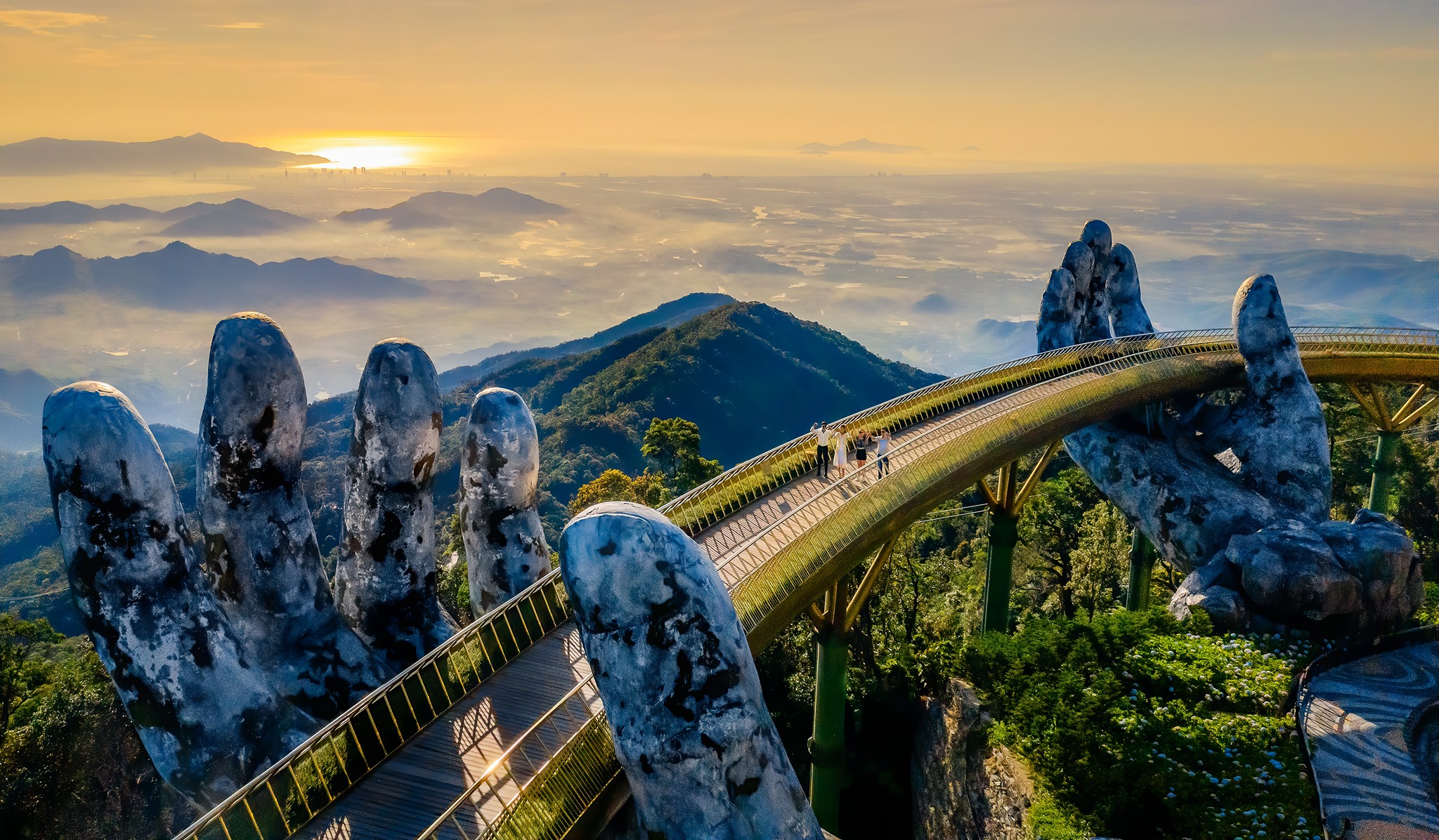 Golden Bridge held by giant stone hands at Ba Na Hills