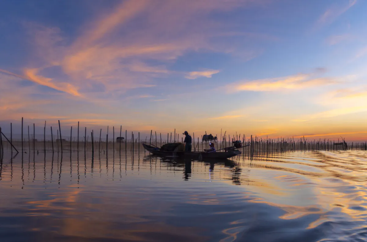 Lagoon water mirrors the sky's fire