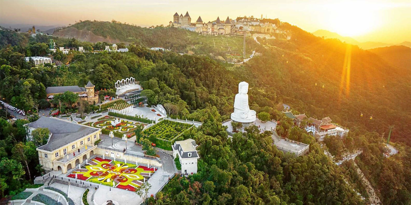 Large white Buddha statue overlooking the mountains
