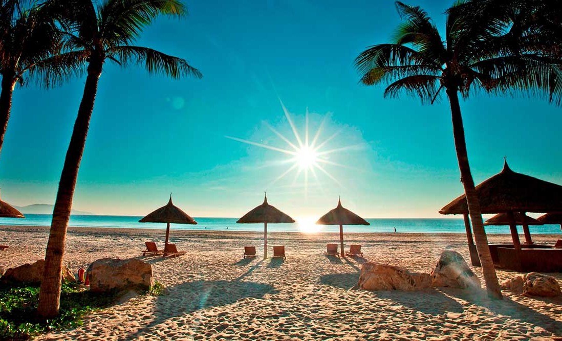 Peaceful coastal scenery near Hoi An with golden sand and clear blue water