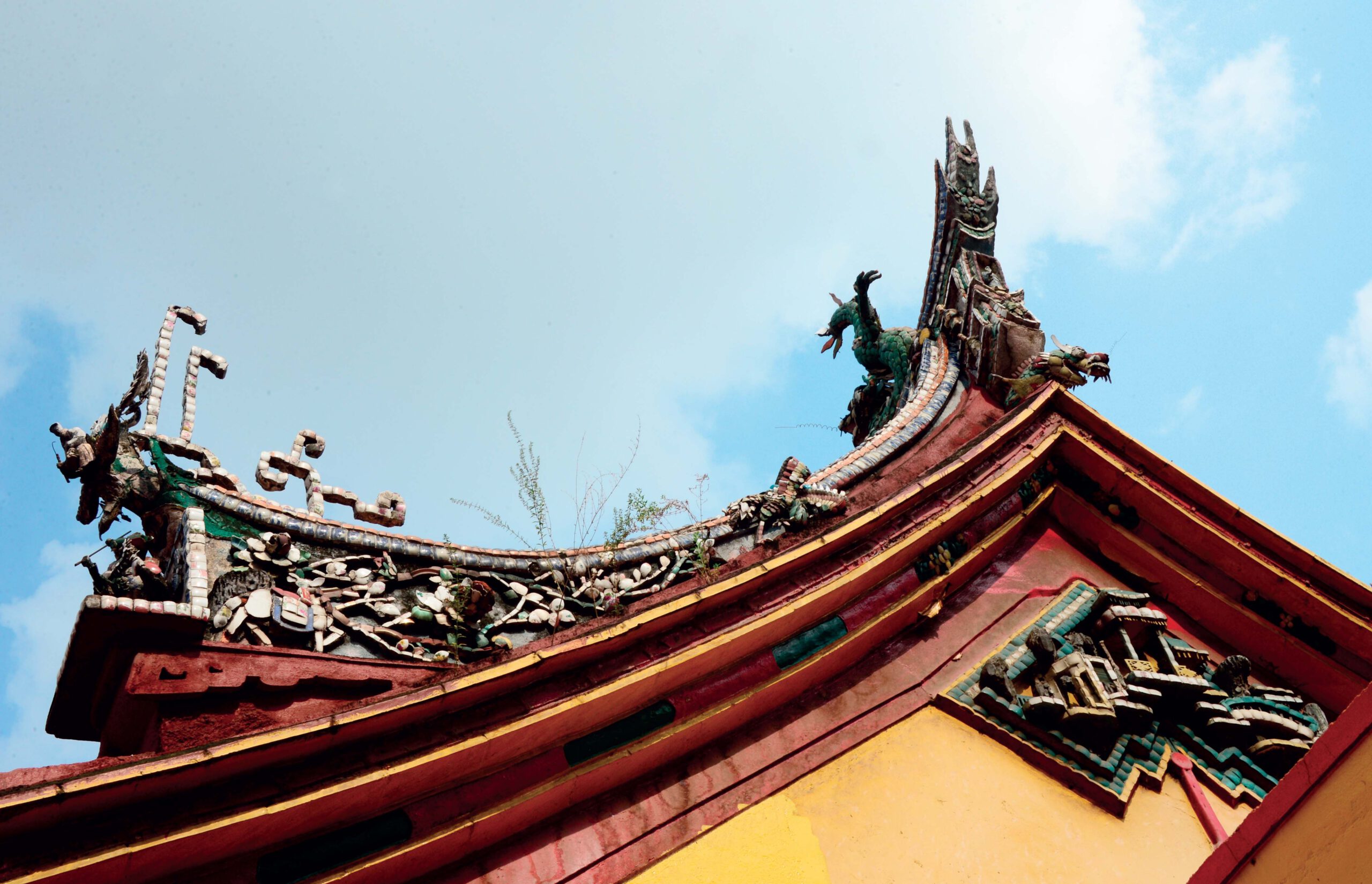 Traditional curved roof architecture of a Chinese temple in Vietnam