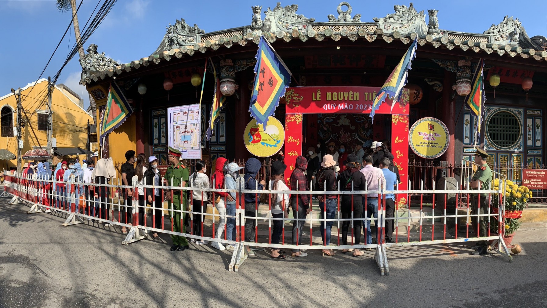 Visitors respectfully observing traditions inside a sacred temple